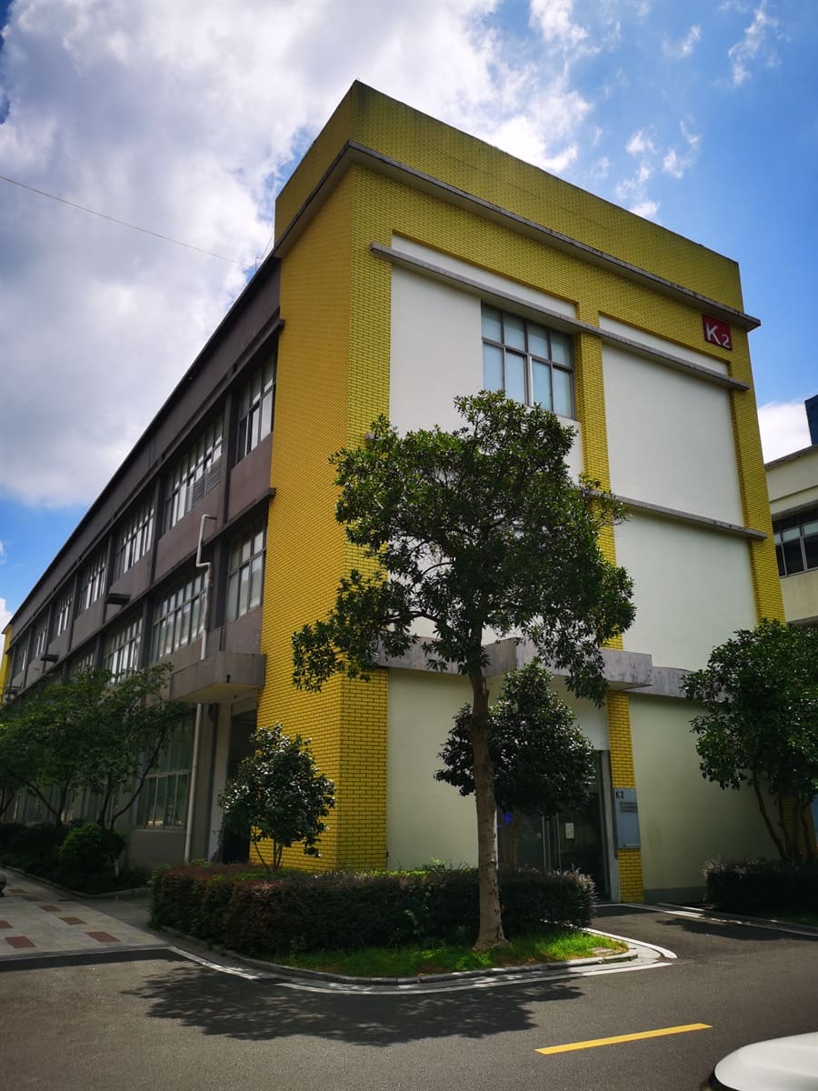 Factory building exterior with yellow facade